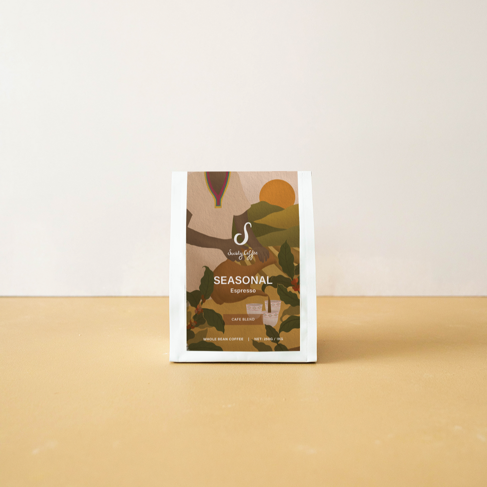 Product packaging with a scenic design on a beige surface